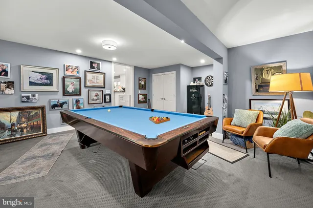 an aerial view of multiple houses with a yard