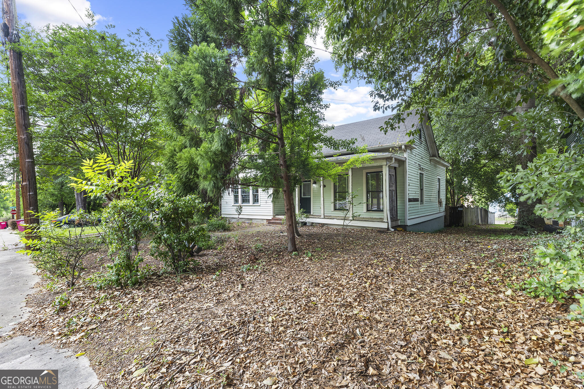 1469 Chestnut Street Macon, GA 31201 - Photo 3 of 26 a house with trees in front of it