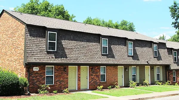 a front view of a house with garden