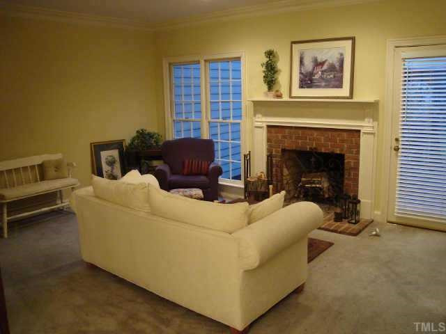 8303 Wycombe Lane Raleigh, NC 27615 - Photo 2 of 10 Large family room with fireplace. Crown molding throughout! Other