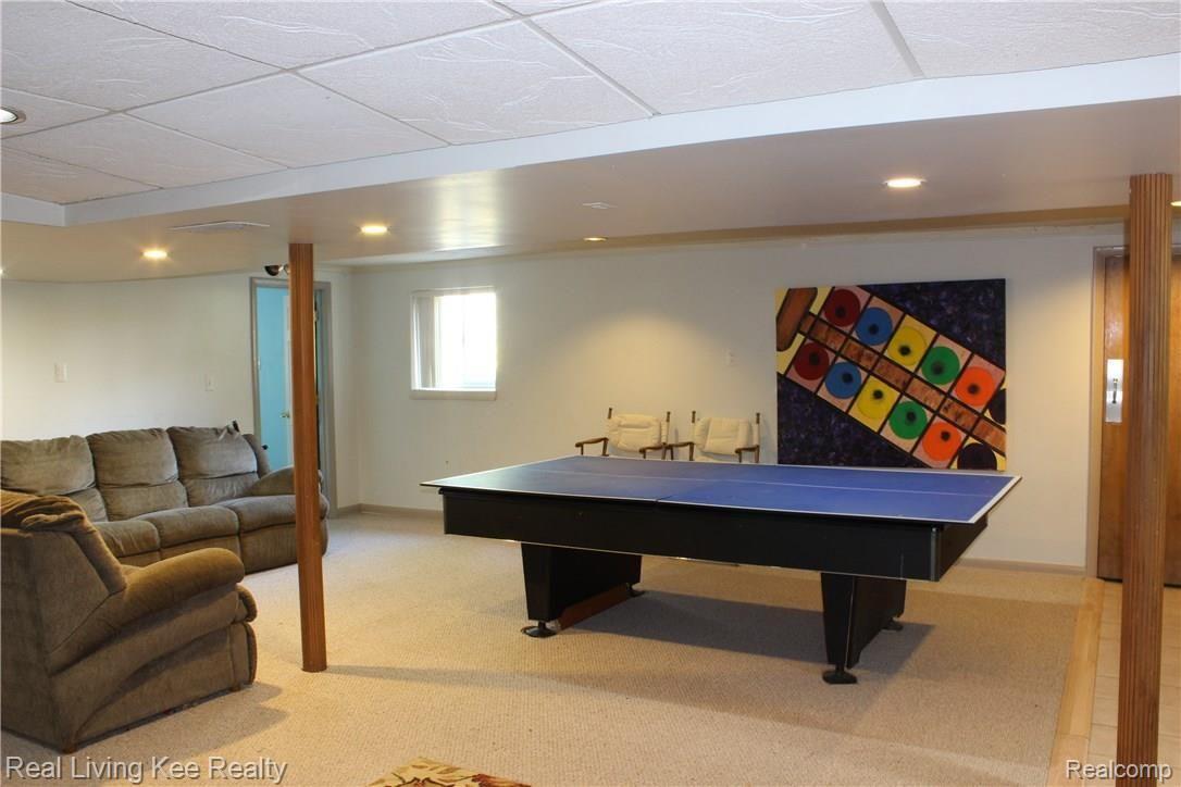 4620 Durham Road Utica, MI 48317 - Photo 24 of 38 Huge lower level family room has a ton of space and a wood burning stove!