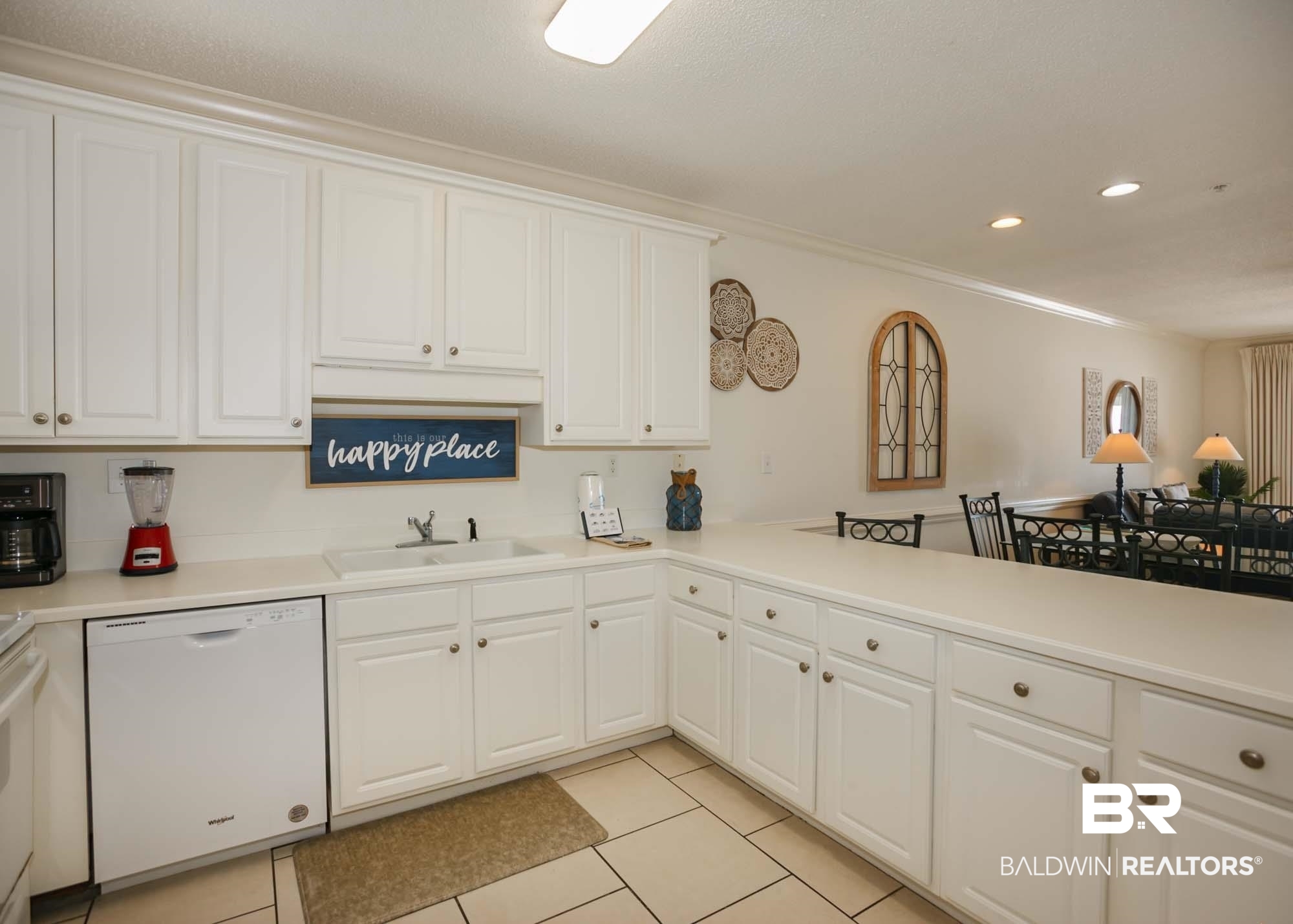 28910 Perdido Beach Boulevard, Unit 4B Orange Beach, AL 36561 - Photo 8 of 48 Kitchen featuring a sink, white cabinets, light countertops, and dishwasher