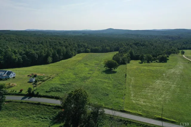 a view of a garden with an outdoor seating