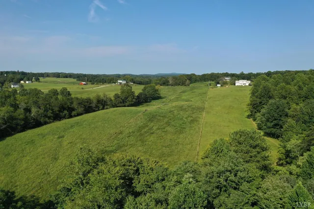 a view of a field with an ocean