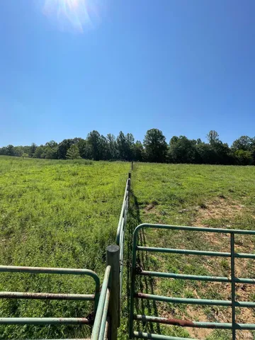 a view of a large body of water with a house in the background