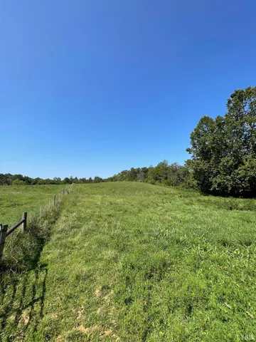 a view of lake and green valley