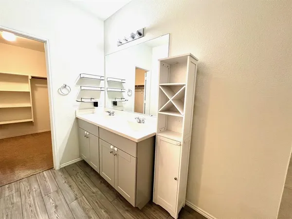 a utility room with cabinets washer and dryer