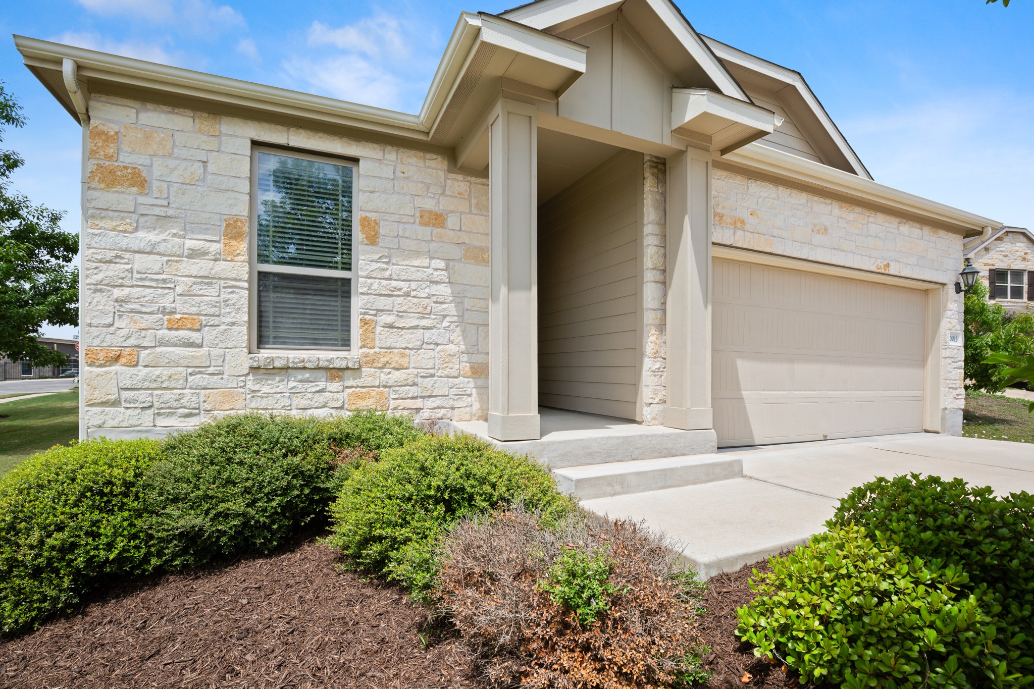 10012 Epic Knoll Drive Austin, TX 78747 - Photo 1 of 31 a front view of a house with garden