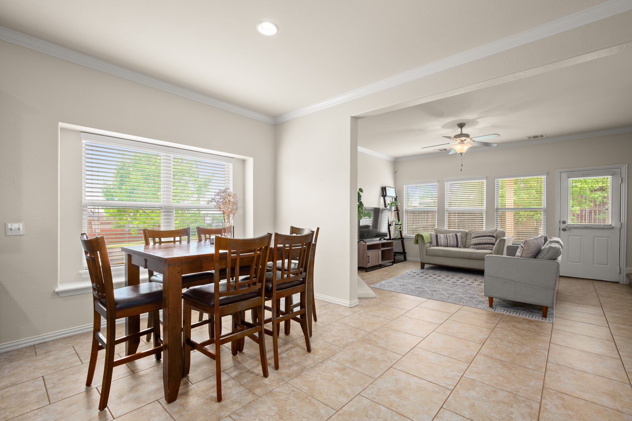 10012 Epic Knoll Drive Austin, TX 78747 - Photo 11 of 31 a view of a dining room with furniture and a large window