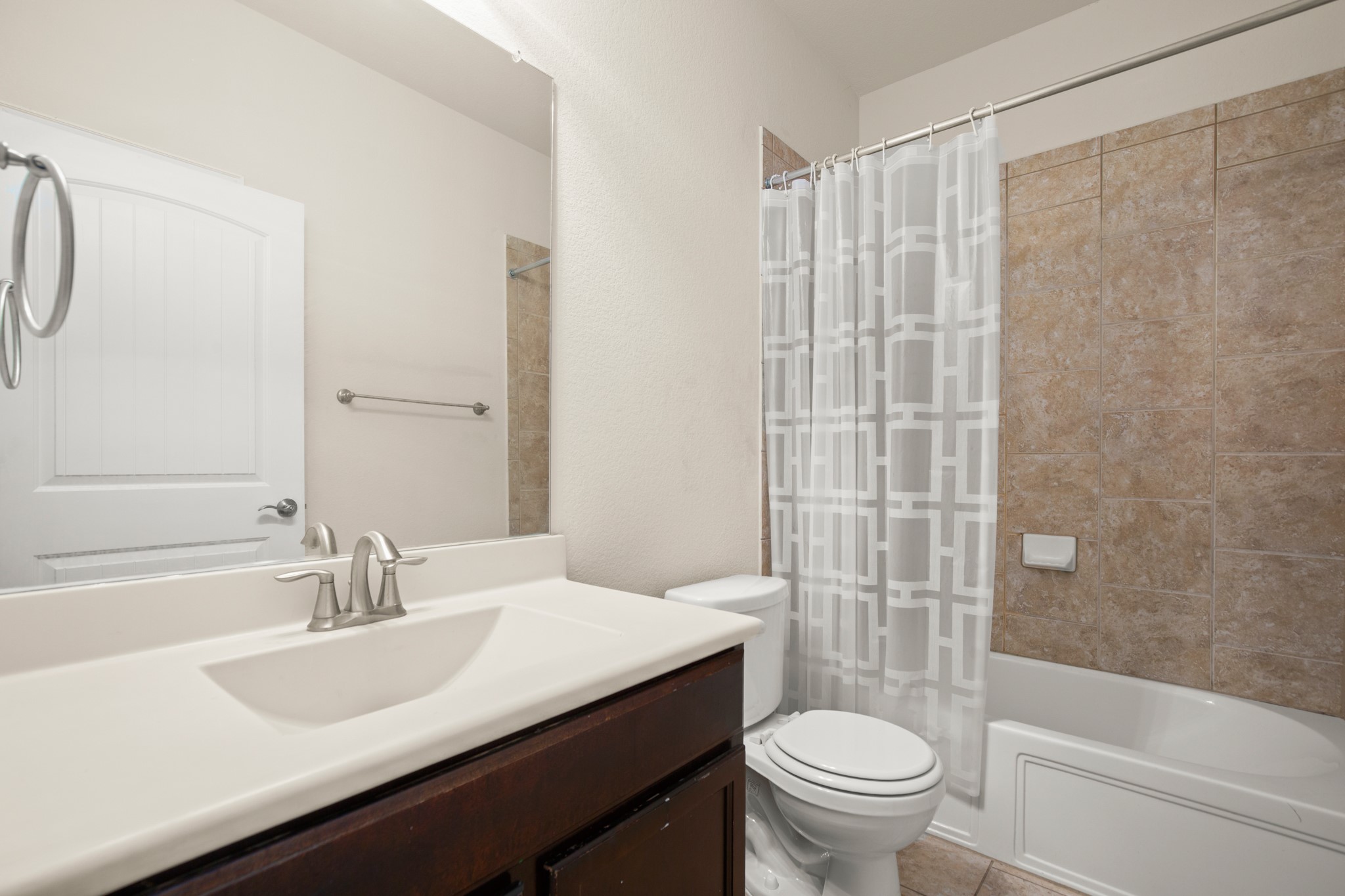 10012 Epic Knoll Drive Austin, TX 78747 - Photo 21 of 31 a bathroom with a sink toilet and shower