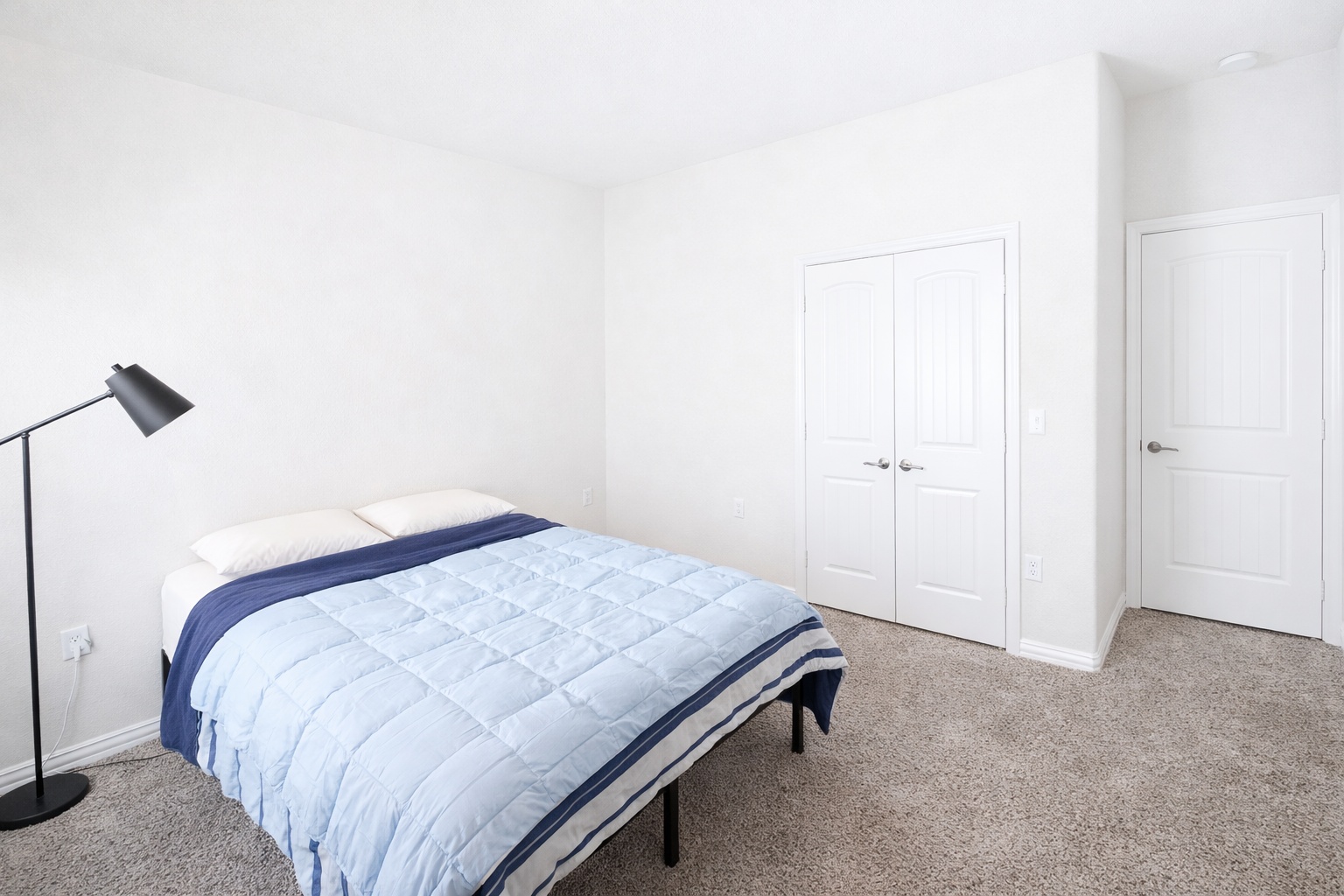 10012 Epic Knoll Drive Austin, TX 78747 - Photo 22 of 31 a bedroom with a bed and a ceiling fan