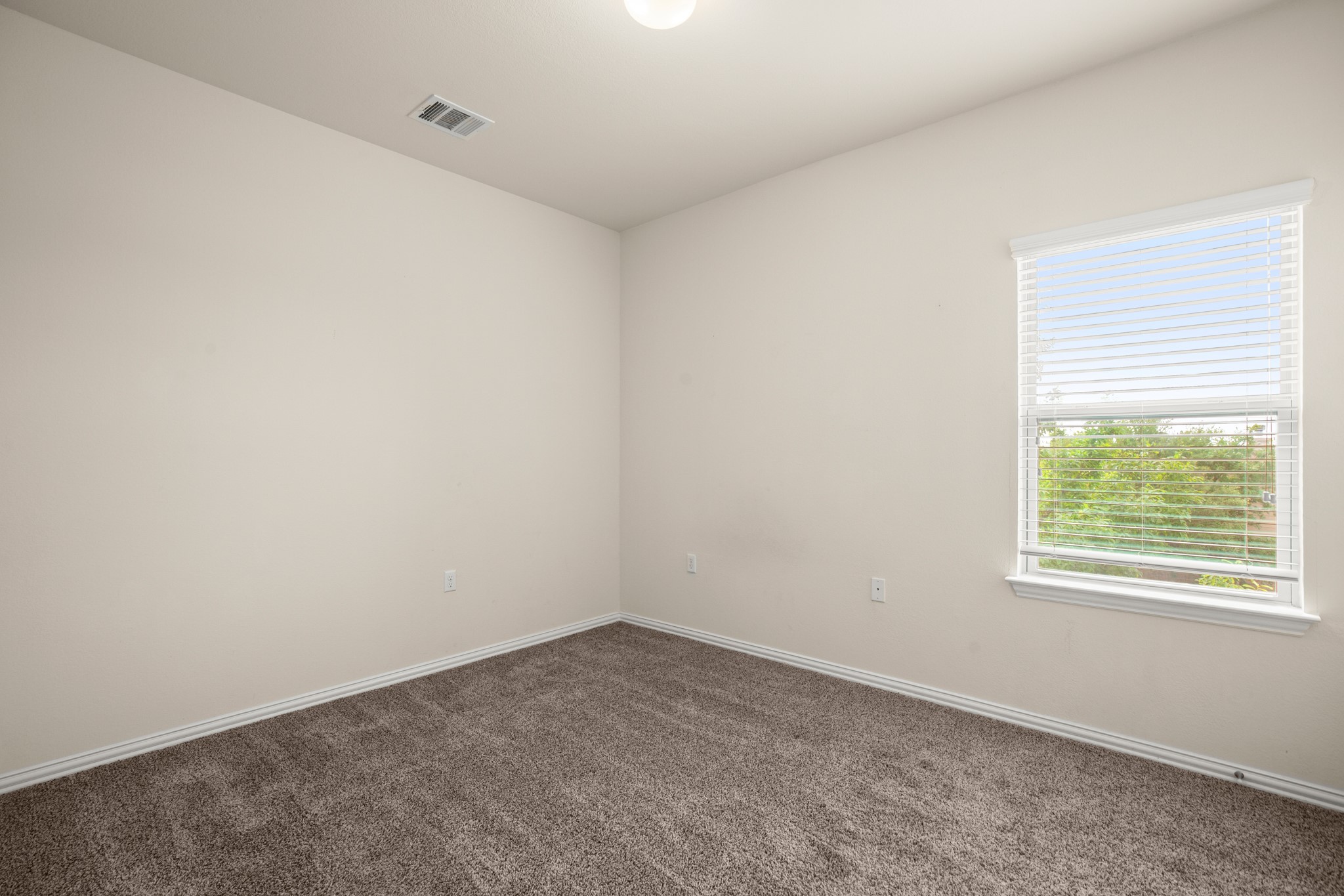 10012 Epic Knoll Drive Austin, TX 78747 - Photo 23 of 31 an empty room with a window