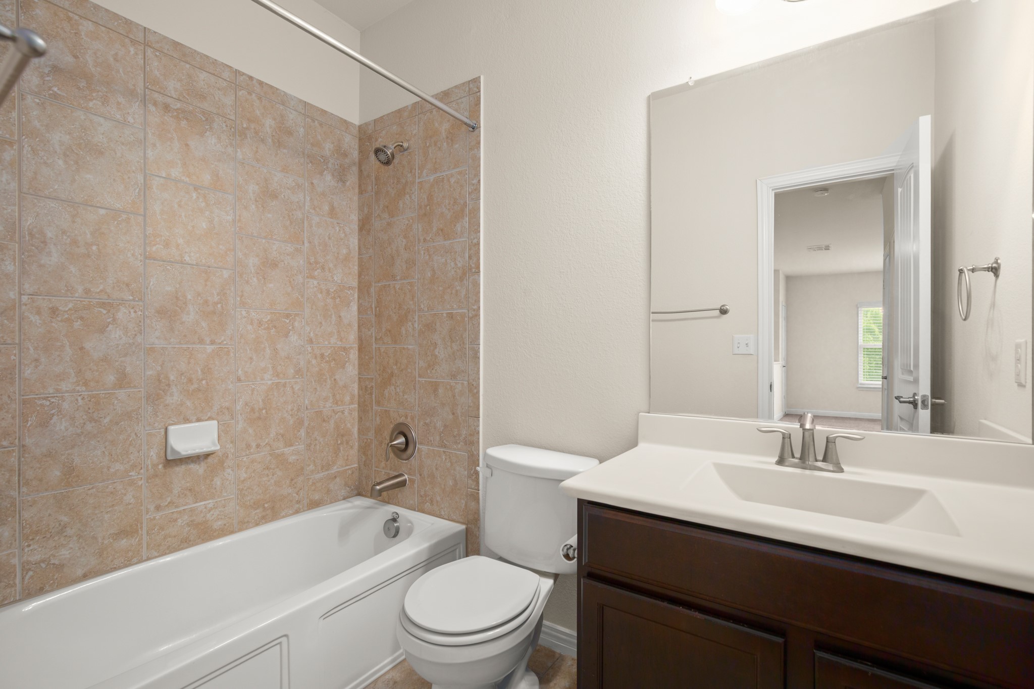 10012 Epic Knoll Drive Austin, TX 78747 - Photo 27 of 31 a bathroom with a sink a toilet and shower