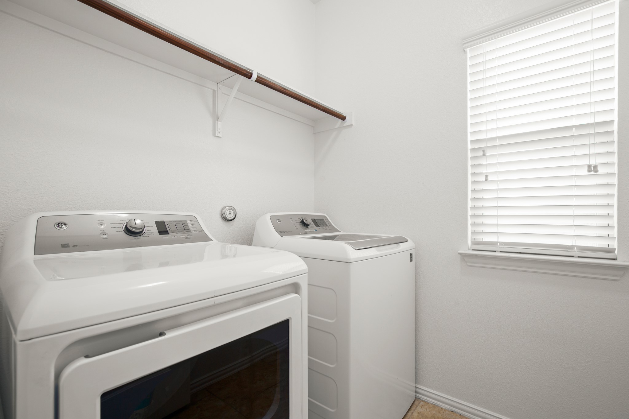 10012 Epic Knoll Drive Austin, TX 78747 - Photo 28 of 31 a utility room with dryer and washer