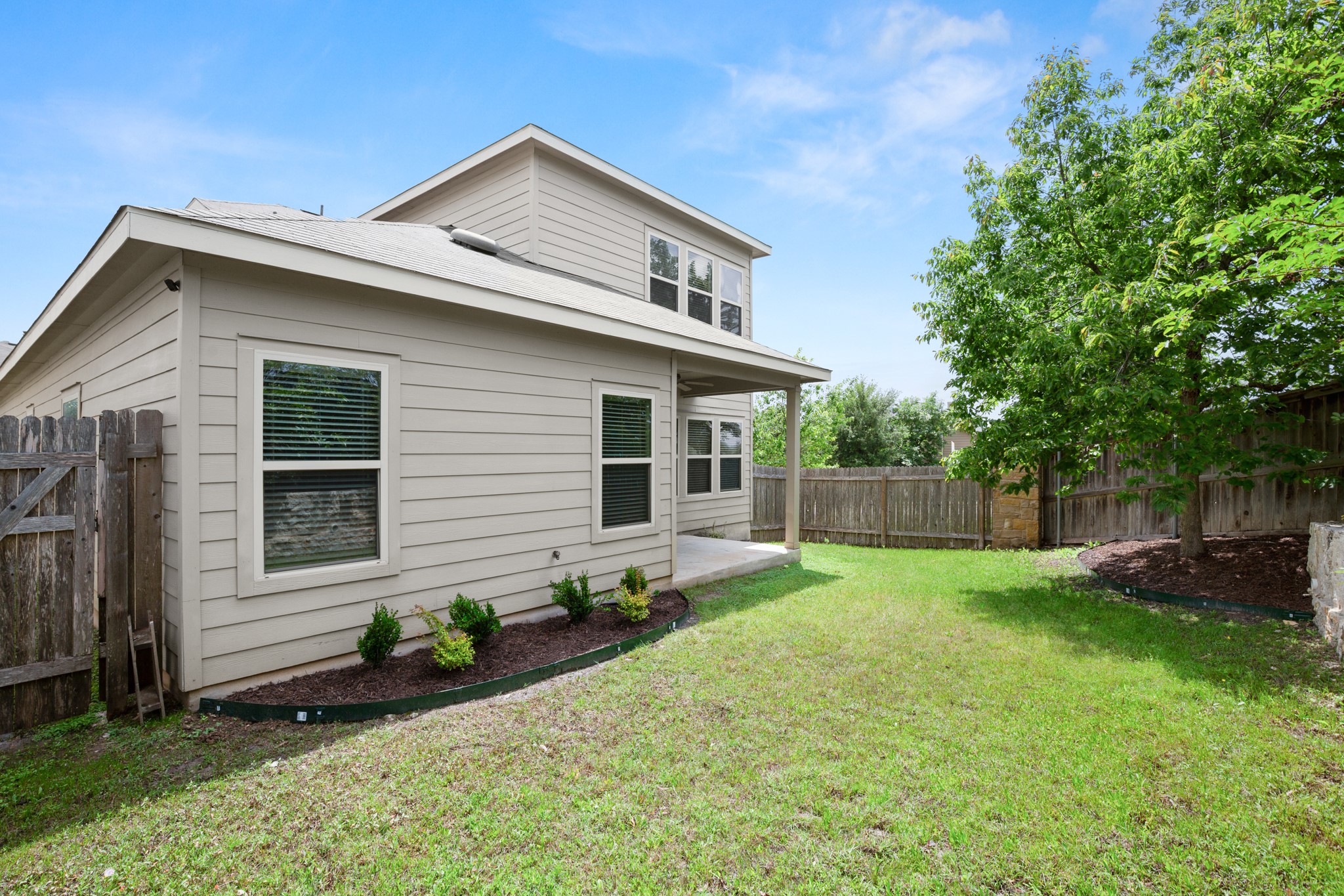 10012 Epic Knoll Drive Austin, TX 78747 - Photo 29 of 31 a front view of house with yard and green space