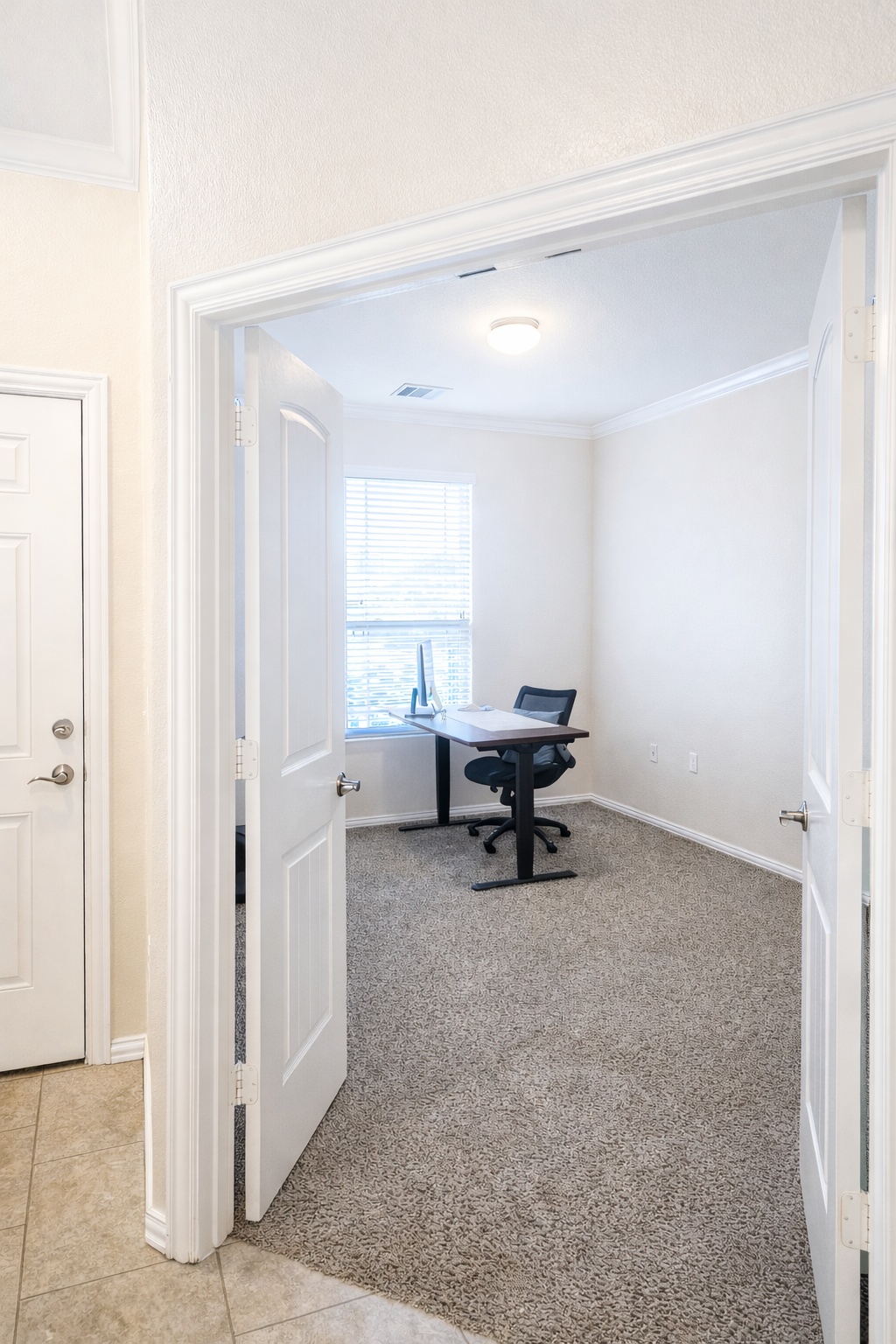 10012 Epic Knoll Drive Austin, TX 78747 - Photo 8 of 31 a view of a room with gym equipment and a window