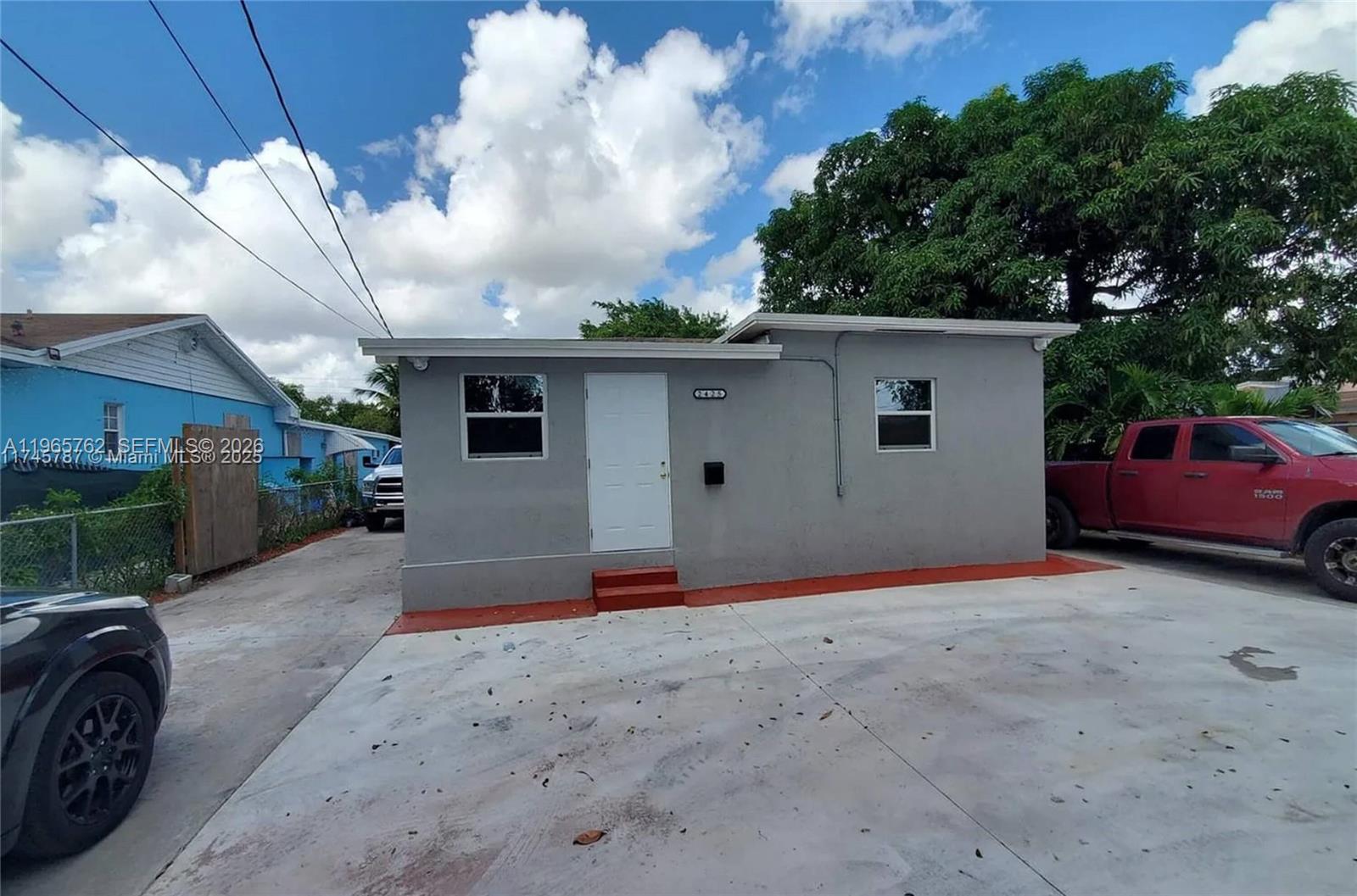 2425 Northwest 28th Street Miami, FL 33142 - Photo 2 of 18 a view of backyard with wheel chair and potted plants