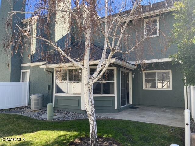 1842 Rory Lane, Unit 7 Simi Valley, CA 93063 - Photo 1 of 19 a view of a house with brick walls and a yard with plants