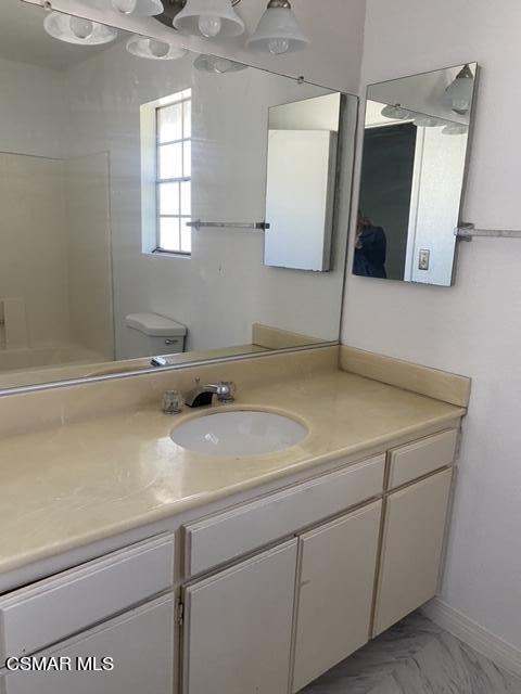 1842 Rory Lane, Unit 7 Simi Valley, CA 93063 - Photo 13 of 19 a bathroom with a sink and mirror