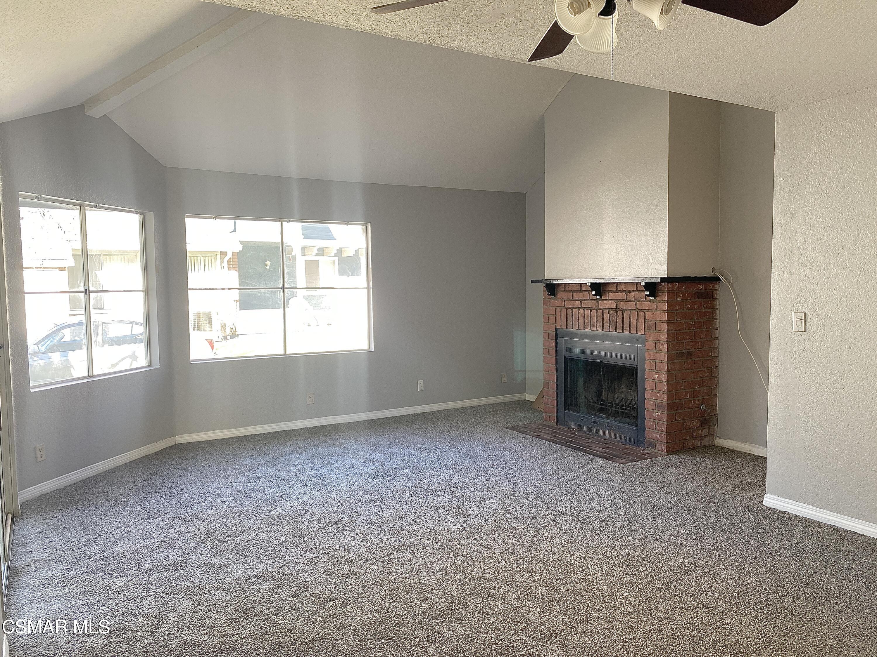 1842 Rory Lane, Unit 7 Simi Valley, CA 93063 - Photo 6 of 19 a view of empty room with a fireplace and windows