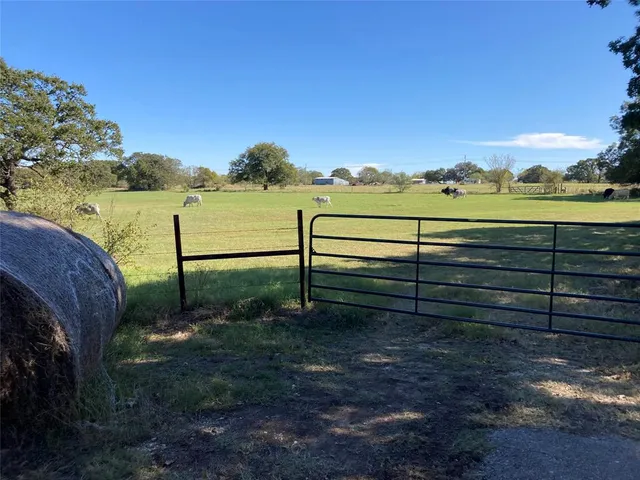 a view of a lake with a yard