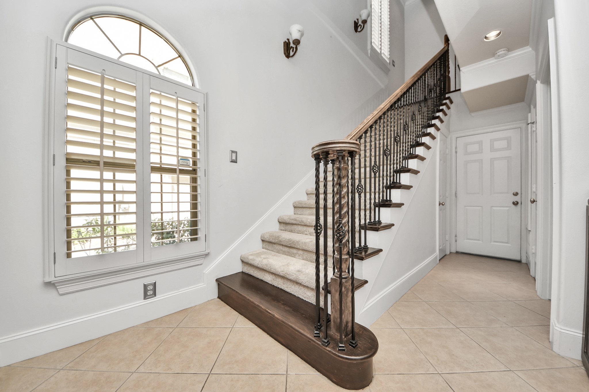 710 Jackson Hill Street Houston, TX 77007 - Photo 5 of 31 The space has tiled flooring and a large arched window with plantation shutters throughout.