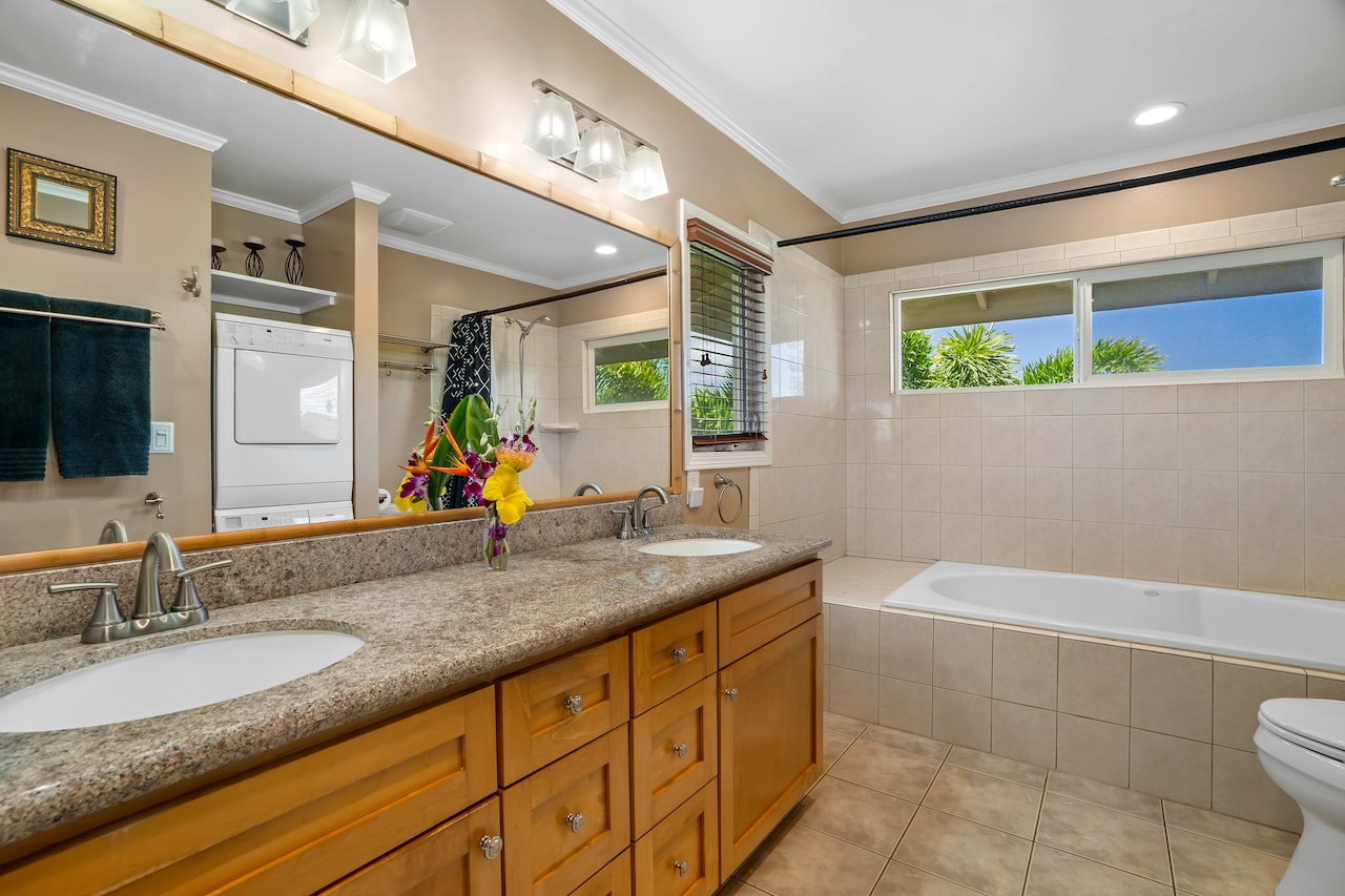 2889 Milo Hae Loop Koloa, HI 96756 - Photo 15 of 27 a bathroom with a granite countertop sink and a large mirror