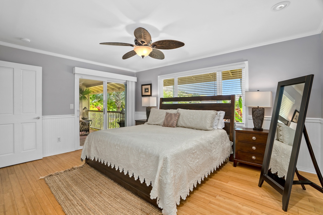 2889 Milo Hae Loop Koloa, HI 96756 - Photo 16 of 27 a bedroom with a bed and a chandelier