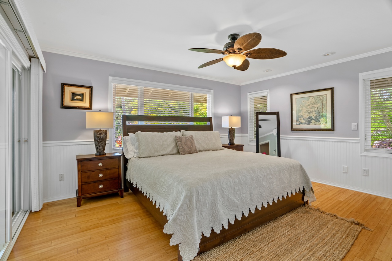 2889 Milo Hae Loop Koloa, HI 96756 - Photo 19 of 27 a bedroom with a bed and a painting on the wall
