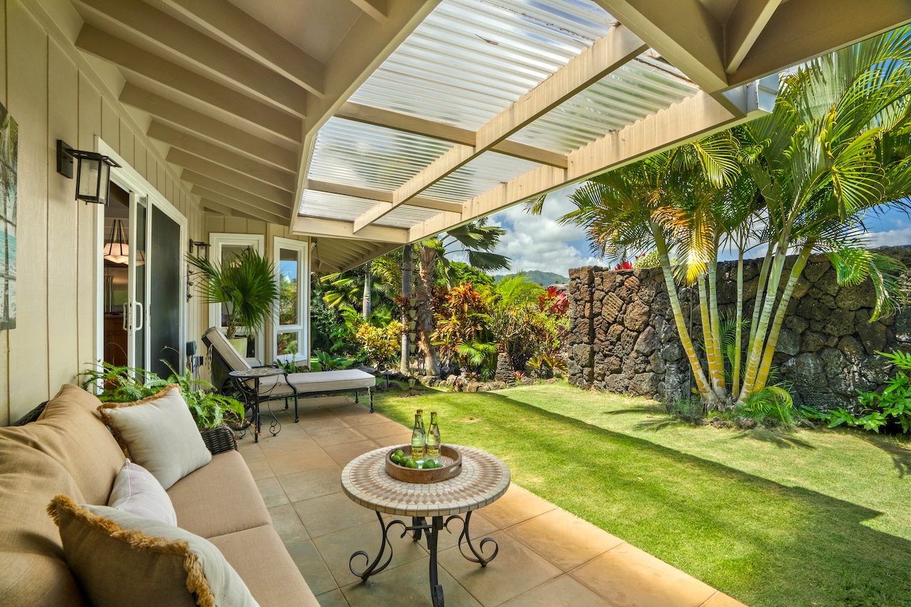 2889 Milo Hae Loop Koloa, HI 96756 - Photo 23 of 27 a view of a chairs and tables in the backyard of a house