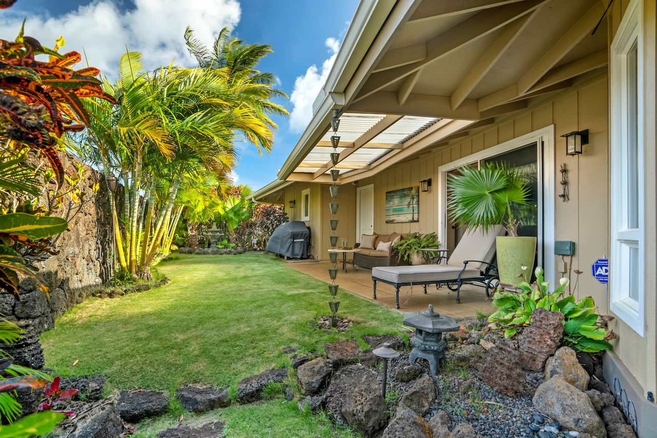 2889 Milo Hae Loop Koloa, HI 96756 - Photo 25 of 27 a view of a chair and table in backyard of the house