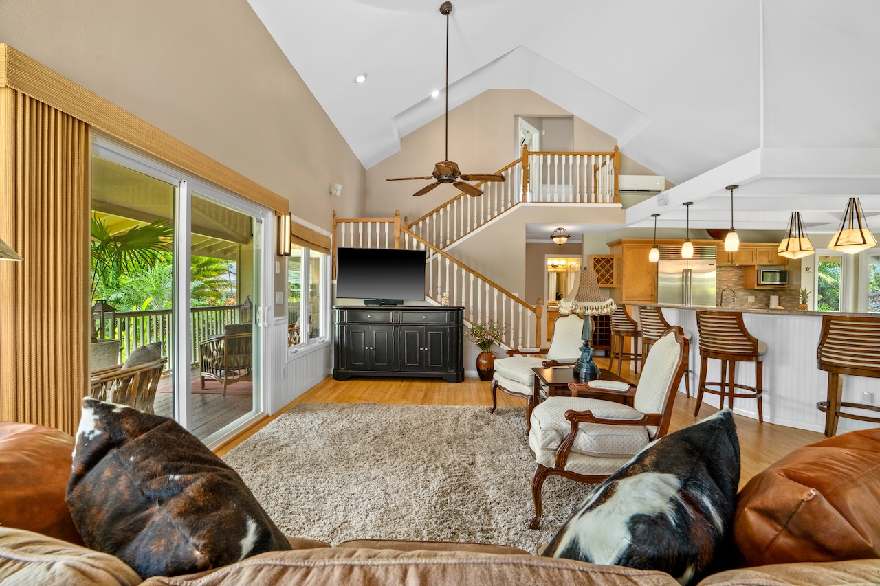 2889 Milo Hae Loop Koloa, HI 96756 - Photo 3 of 27 a living room with furniture ceiling fan and a floor to ceiling window