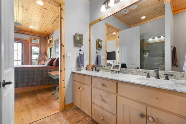a bathroom with a tub and shower