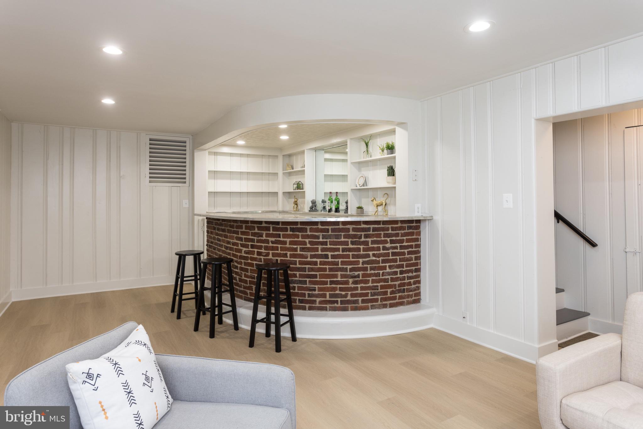 412 Aigburth Road Baltimore, MD 21286 - Photo 22 of 29 Chic basement bar with modern flair.