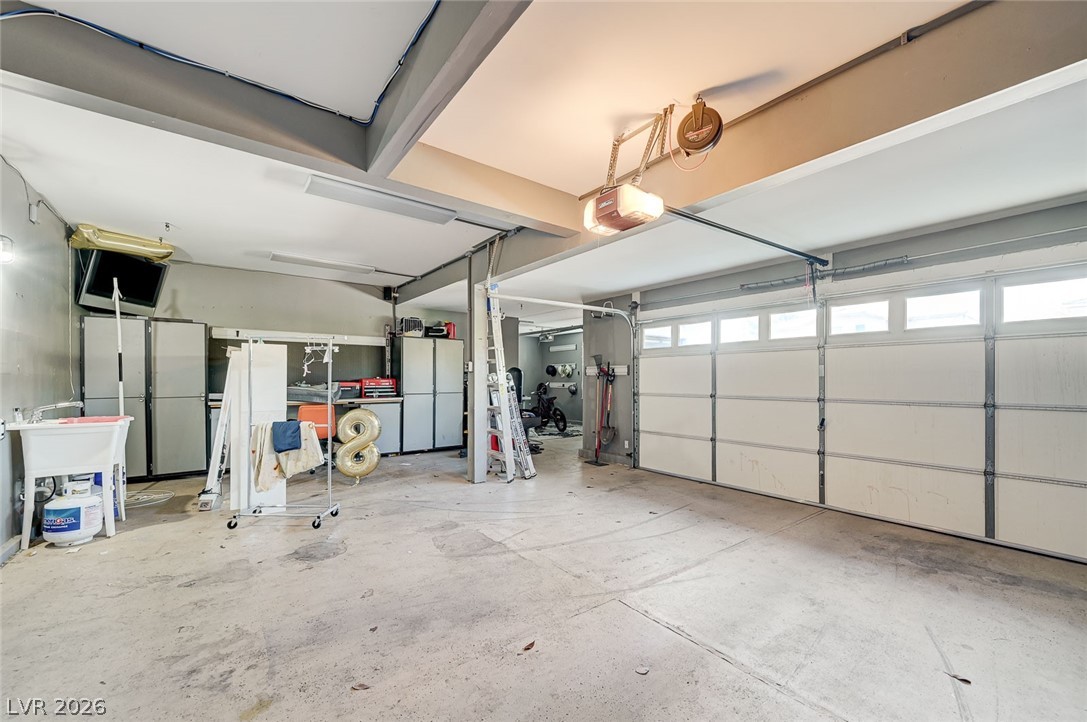 2391 Rainswept Avenue Henderson, NV 89052 - Photo 61 of 62 This spacious garage offers ample room for parking and storage.
