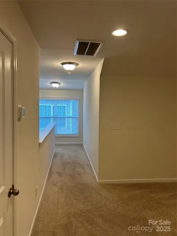 a view of hallway with walk in closet