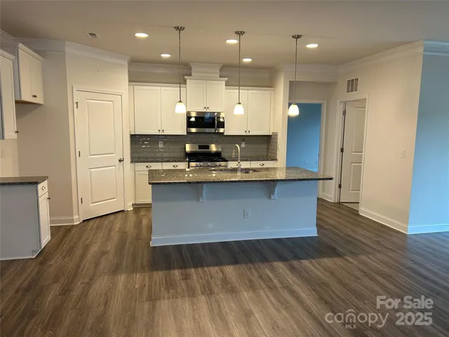a view of kitchen with wooden floor