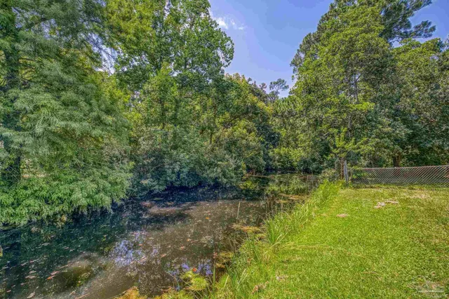 a view of a lake view with a large trees