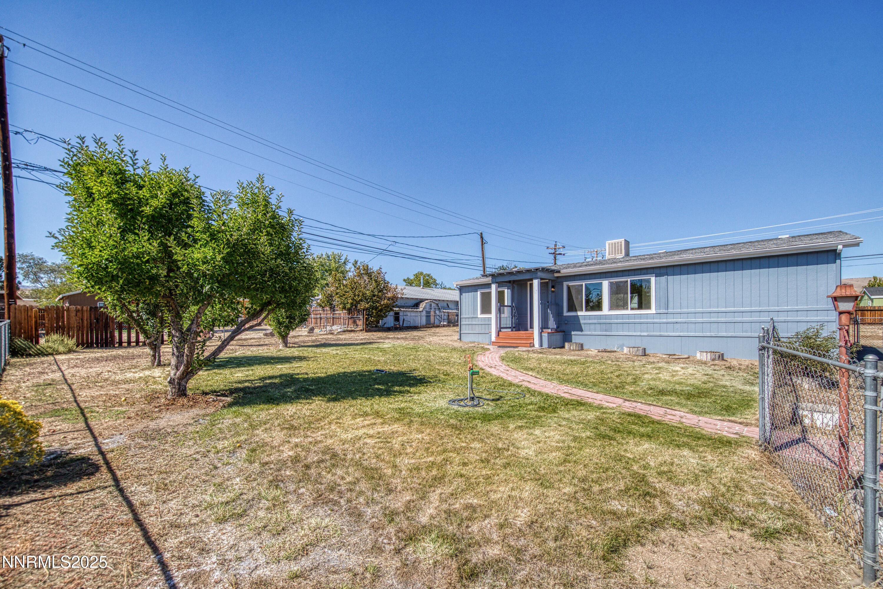 145 Wewoka Way Sun Valley, NV 89433 - Photo 24 of 36 a view of a house with backyard