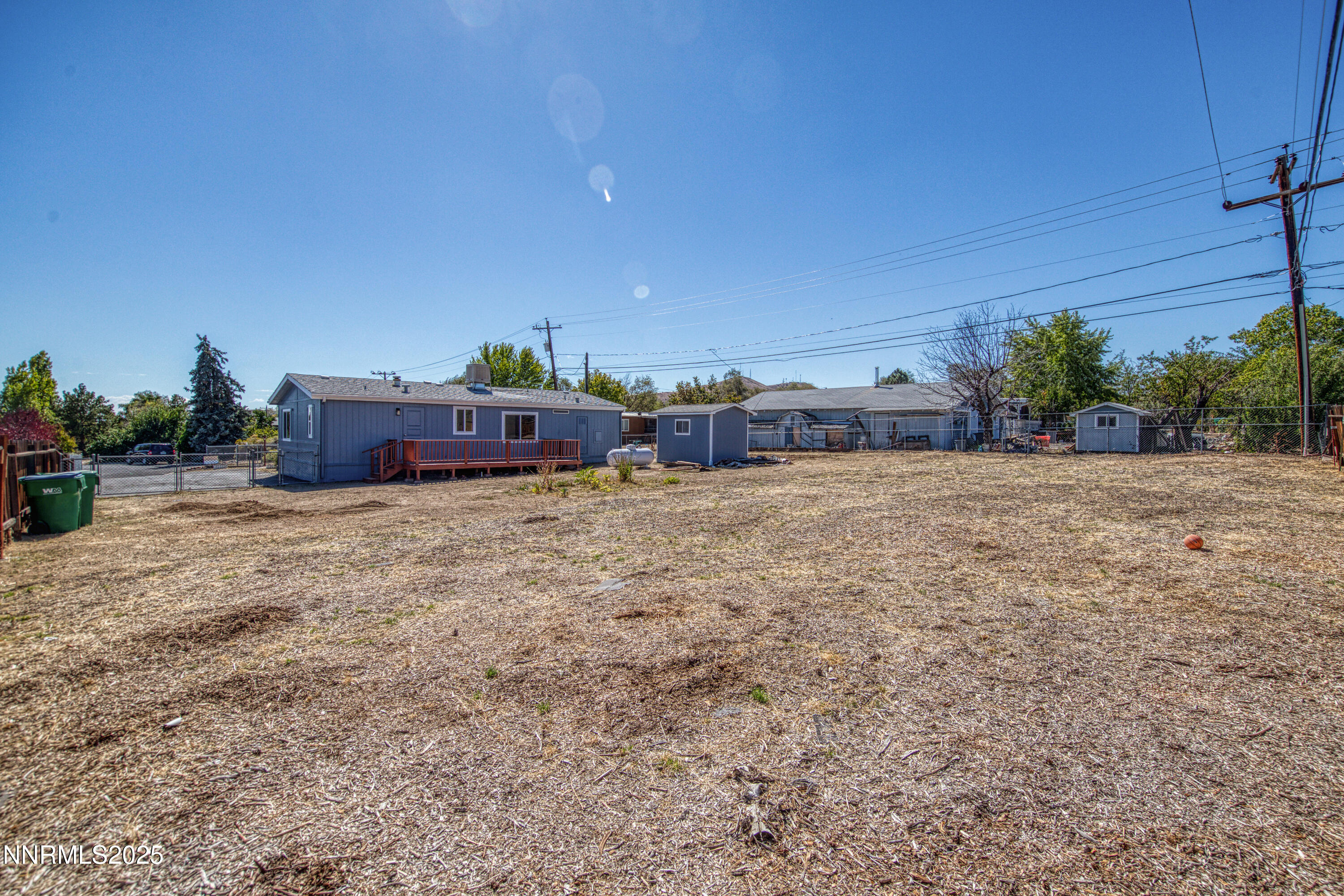 145 Wewoka Way Sun Valley, NV 89433 - Photo 27 of 36 a view of a outdoor space with large trees