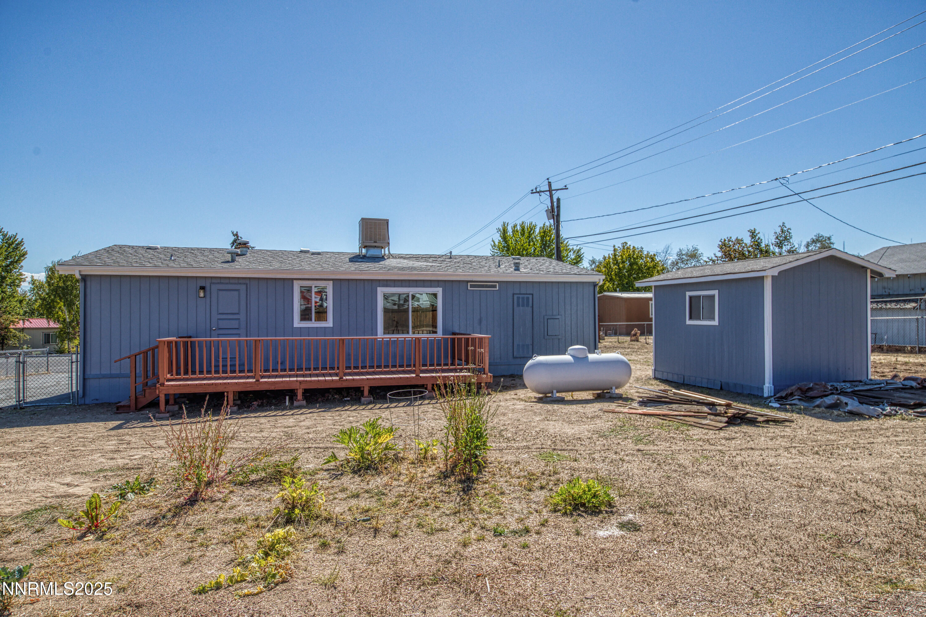 145 Wewoka Way Sun Valley, NV 89433 - Photo 28 of 36 a view of a house with a yard and sitting area