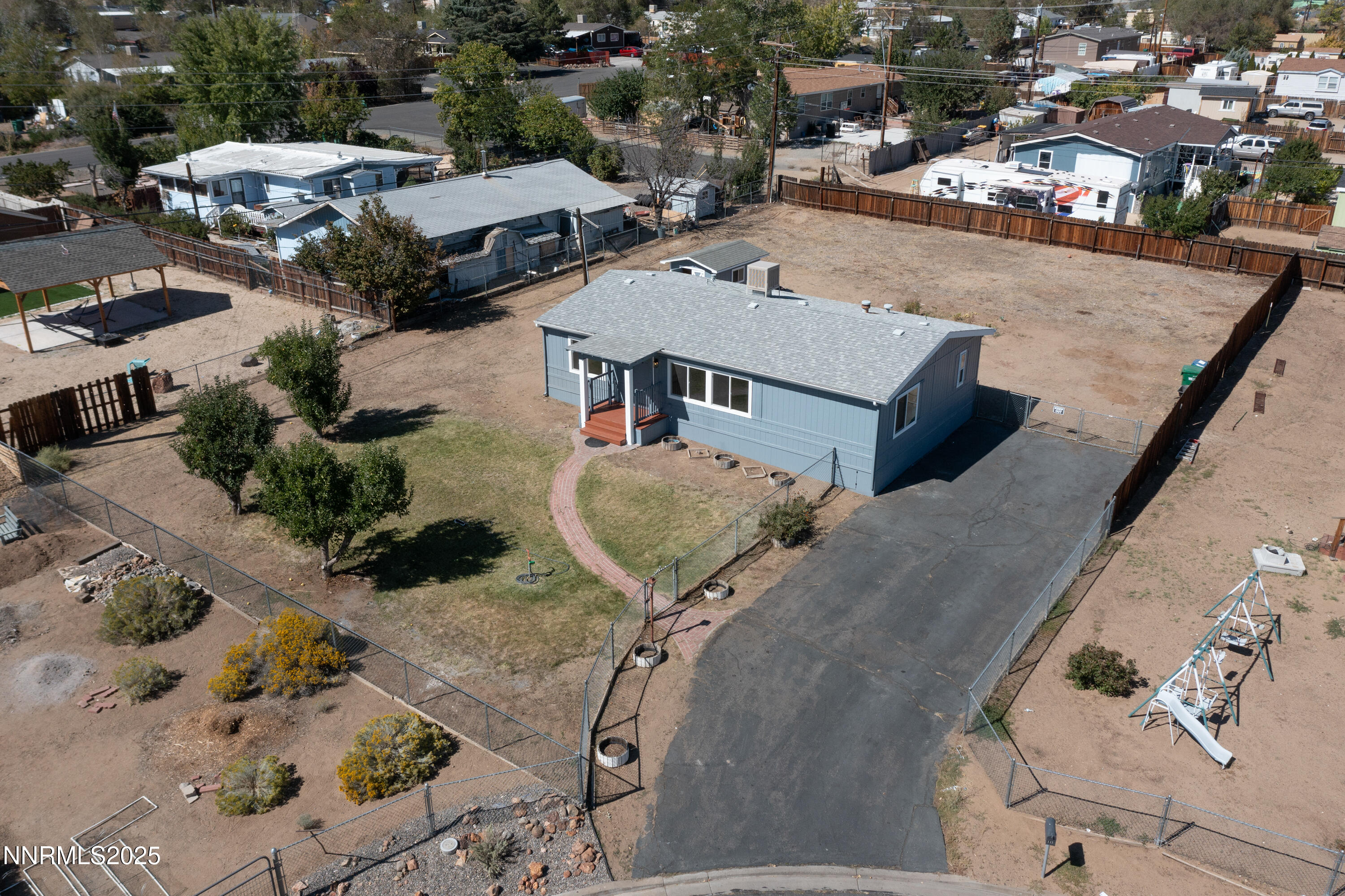 145 Wewoka Way Sun Valley, NV 89433 - Photo 31 of 36 an aerial view of a house with a swimming pool