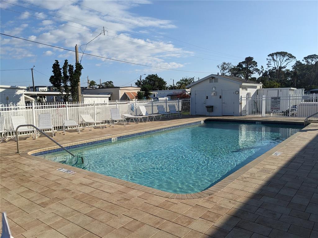 800 32nd Avenue South, Unit 612 St. Petersburg, FL 33705 - Photo 13 of 16 a view of a house with a swimming pool
