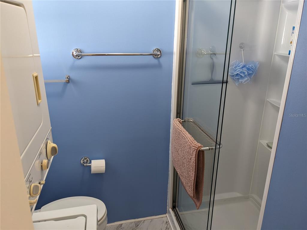 800 32nd Avenue South, Unit 612 St. Petersburg, FL 33705 - Photo 9 of 16 a bathroom with a toilet and a shower
