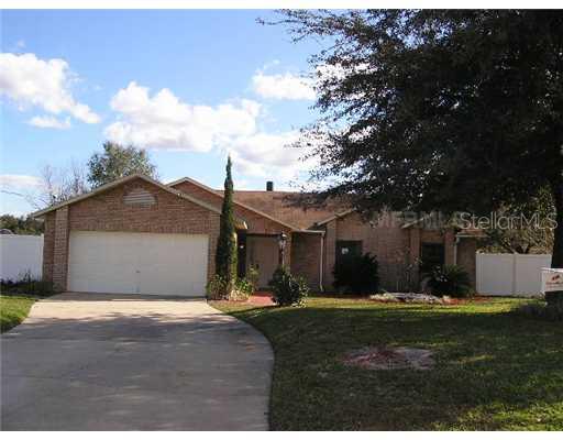 2233 Vance Road Deltona, FL 32738 - Photo 1 of 1 a front view of a house with a yard