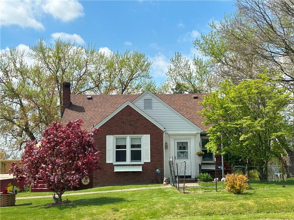 1920 Ridge Rd Extension Ambridge, PA 15003 - Photo 1 of 40 a front view of a house with a garden