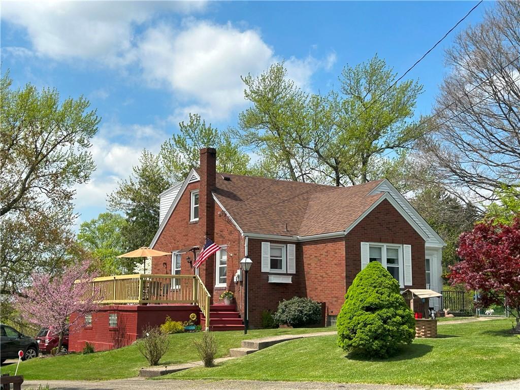 1920 Ridge Rd Extension Ambridge, PA 15003 - Photo 2 of 40 a front view of a house with a yard