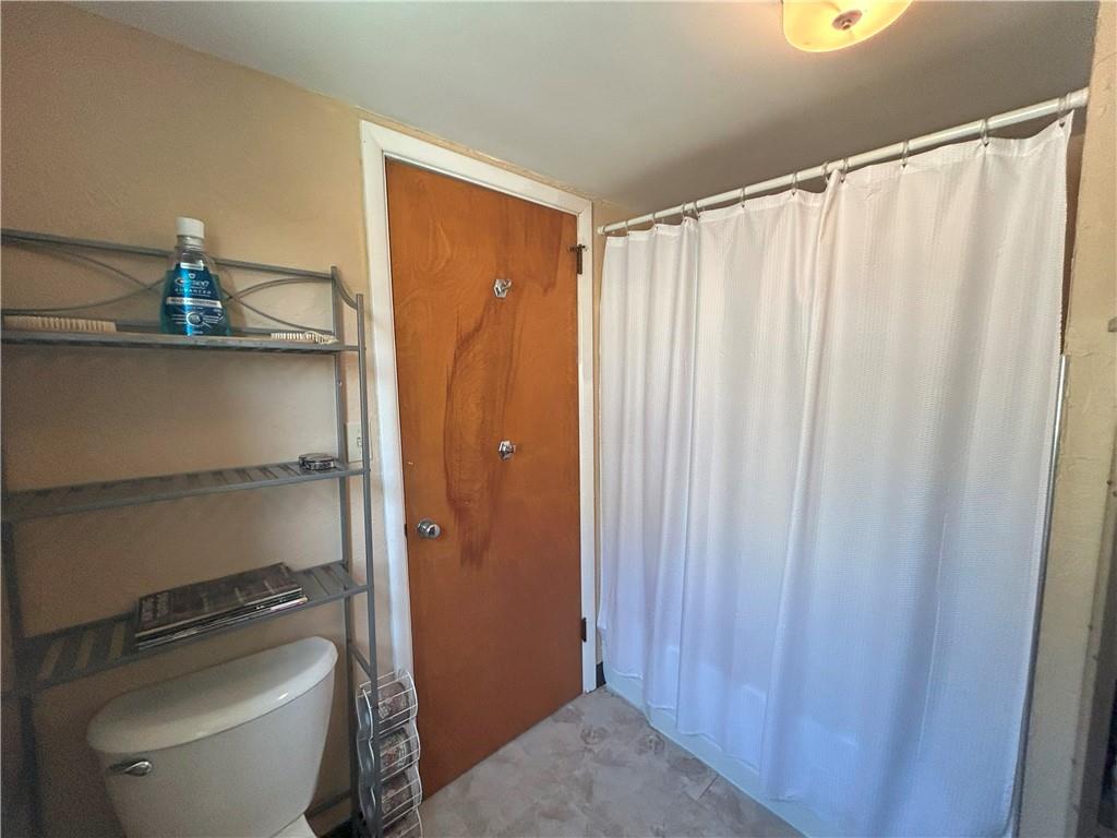 1920 Ridge Rd Extension Ambridge, PA 15003 - Photo 27 of 40 a bathroom with a shower a toilet and sink