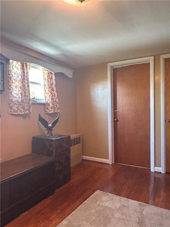 1920 Ridge Rd Extension Ambridge, PA 15003 - Photo 28 of 40 an empty room with wooden floor windows and cabinet