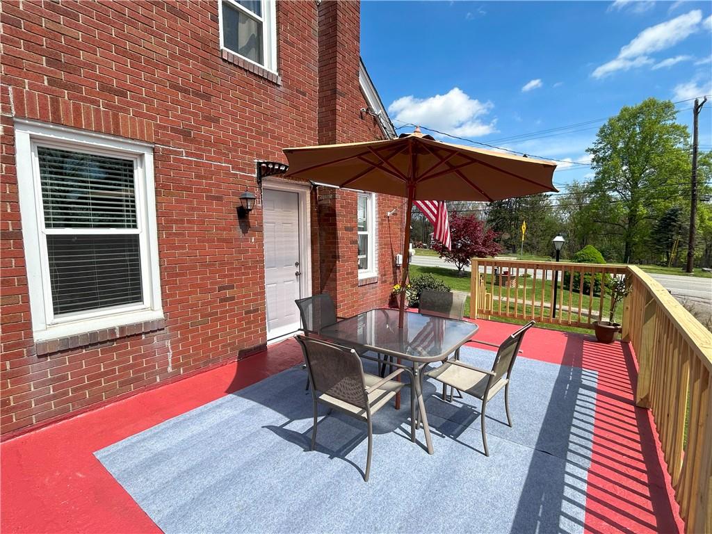 1920 Ridge Rd Extension Ambridge, PA 15003 - Photo 35 of 40 a view of an outdoor sitting area with furniture and umbrella